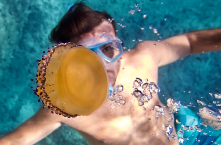 Foto Diving Chia: Bolle e meraviglia. A volte la felicità ha la forma di un bambino dietro una maschera.